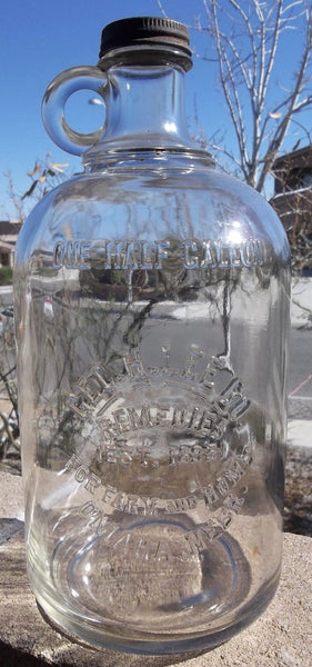 Geo.H.Lee Co. Remedies Glass Jug