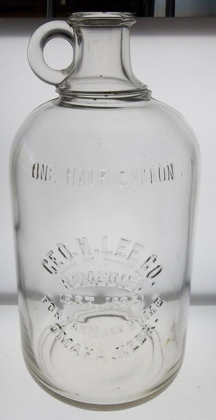Geo.H.Lee Co. Remedies Glass Jug