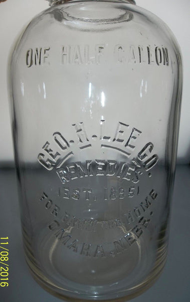 Geo.H.Lee Co. Remedies Glass Jug